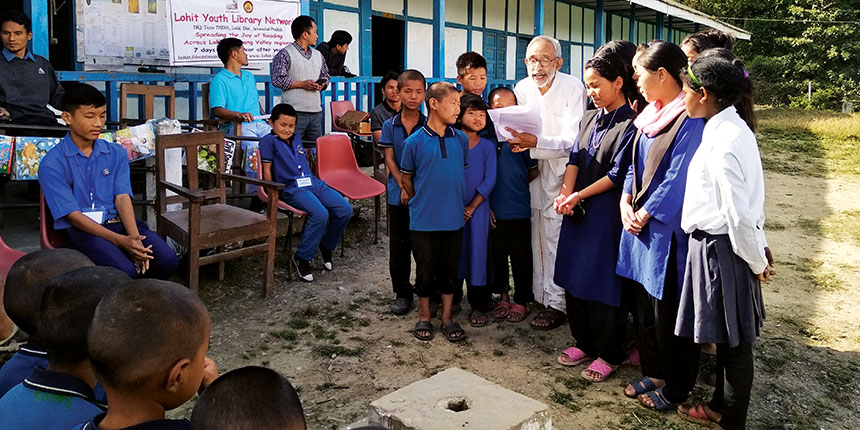 Sathnarayan Mundayoor with school students at a reading campaign