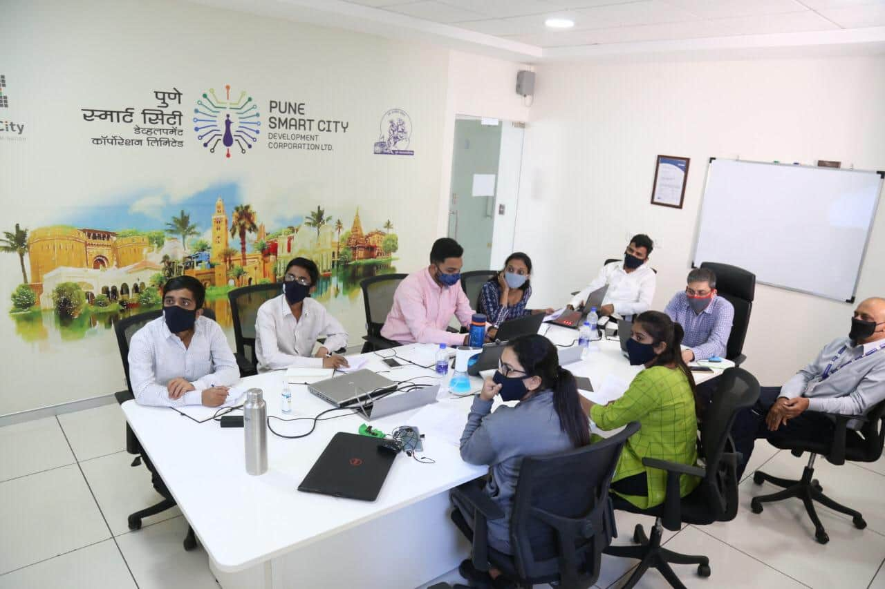 Pranav Raju Savle (centre) with his team and mentor (right) during TULIP internship