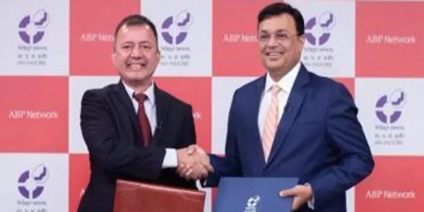 Himanshu Rai, director of IIM Indore with Avinash Pandey, CEO of ABP Network shaking hands after signing the agreement. (Image: IIM Indore)