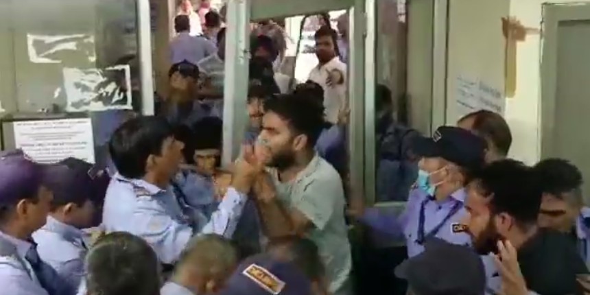 A scuffle broke out in JNU on Monday between a group of students and members of security staff (Image: Twitter/@aishe_ghosh)