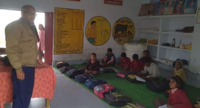 All 116 children in Classes 1 to 8 sit on floor mats at Composite School Gangauli in Uttar Pradesh’s Amethi district. (Image: Sanjay)