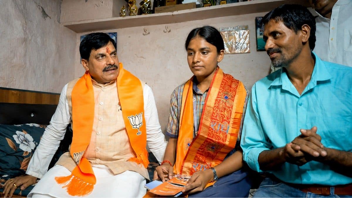 MP CM Yadav rides electric scooter to Class 12 topper's house in slum, wishes her success (Image: Official X, @DrMohanYadav51)