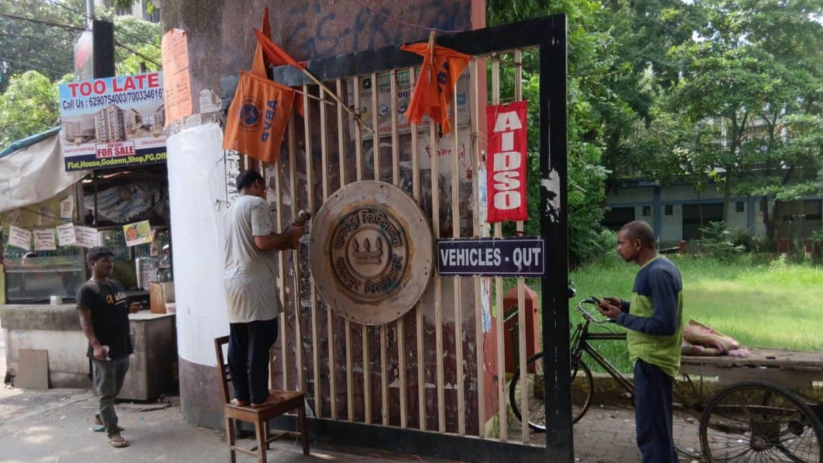 Jadavpur University emblem being repaired. After the violence, JU students question the collapse of security (Image: Careers360)