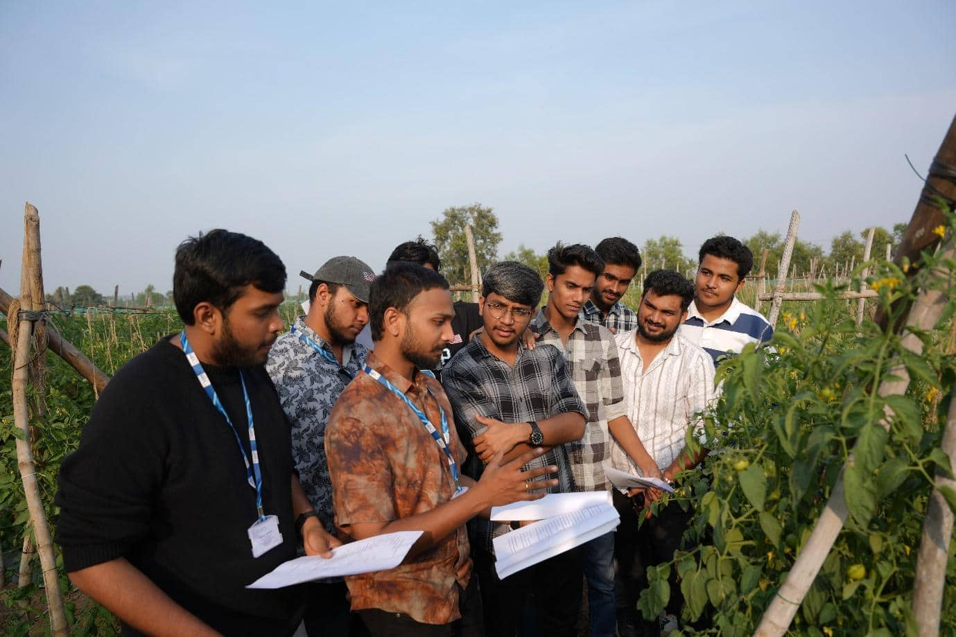 A group of men standing in a garden

AI-generated content may be incorrect.