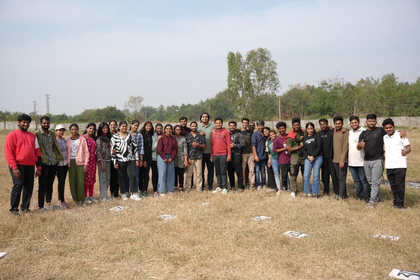 A group of people standing in a field with Cadillac Ranch in the background

AI-generated content may be incorrect.