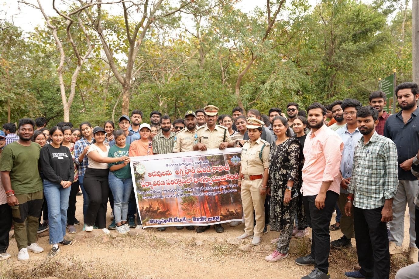 A group of people standing together holding a banner

AI-generated content may be incorrect.