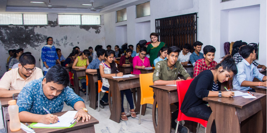 Students writing exams Source: Shutterstock