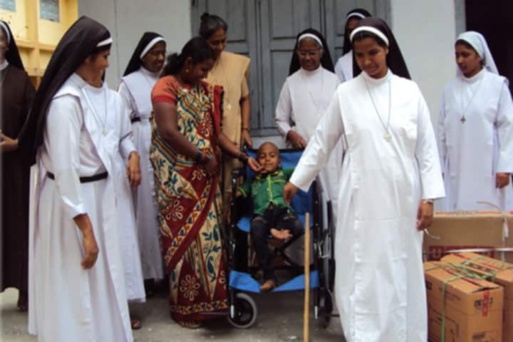 Carmel Convent School-Donating The Wheel Chair For The Disabled